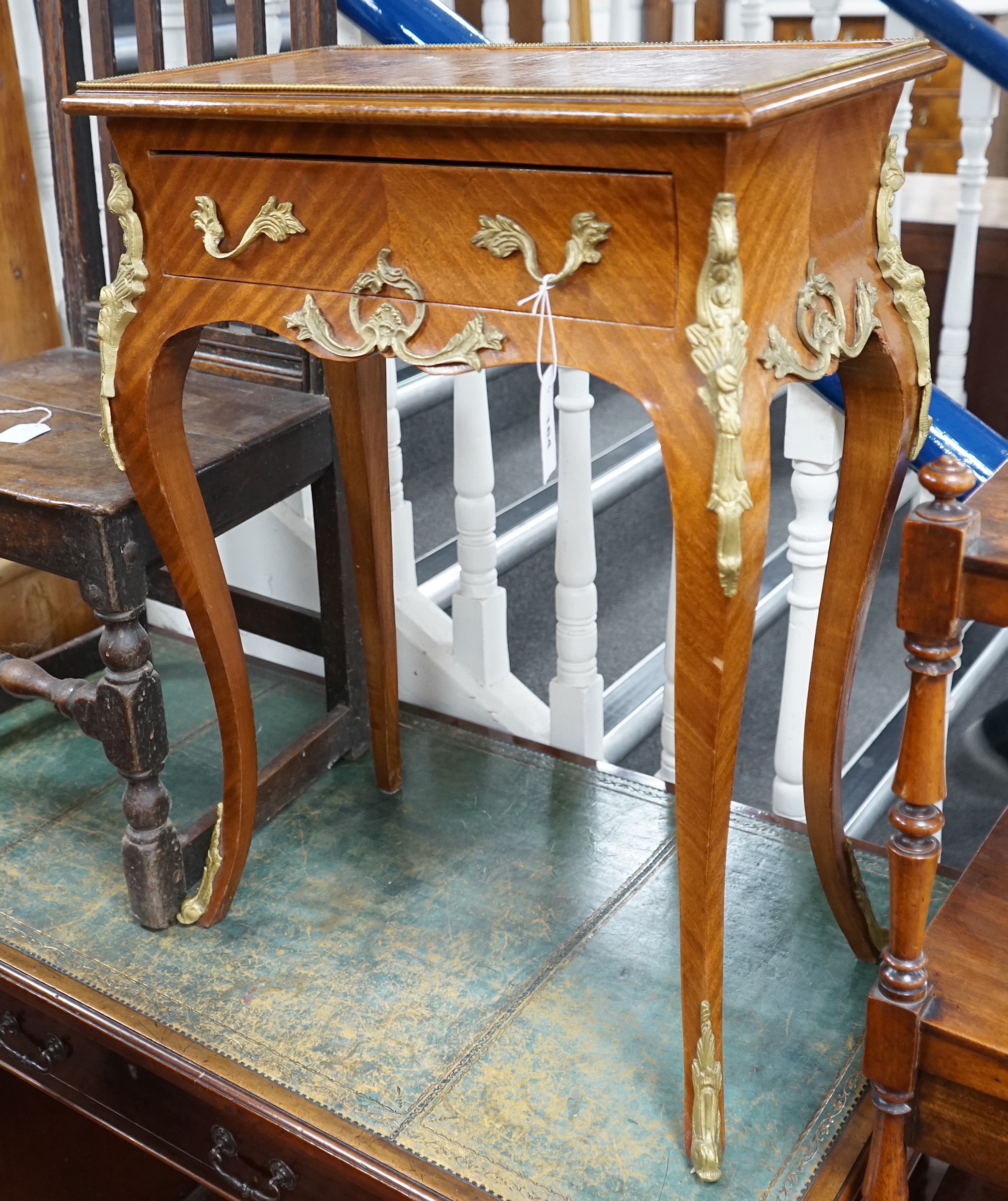 A Louis XVI style gilt metal mounted side table, width 56cm, depth 33cm, height 76cm